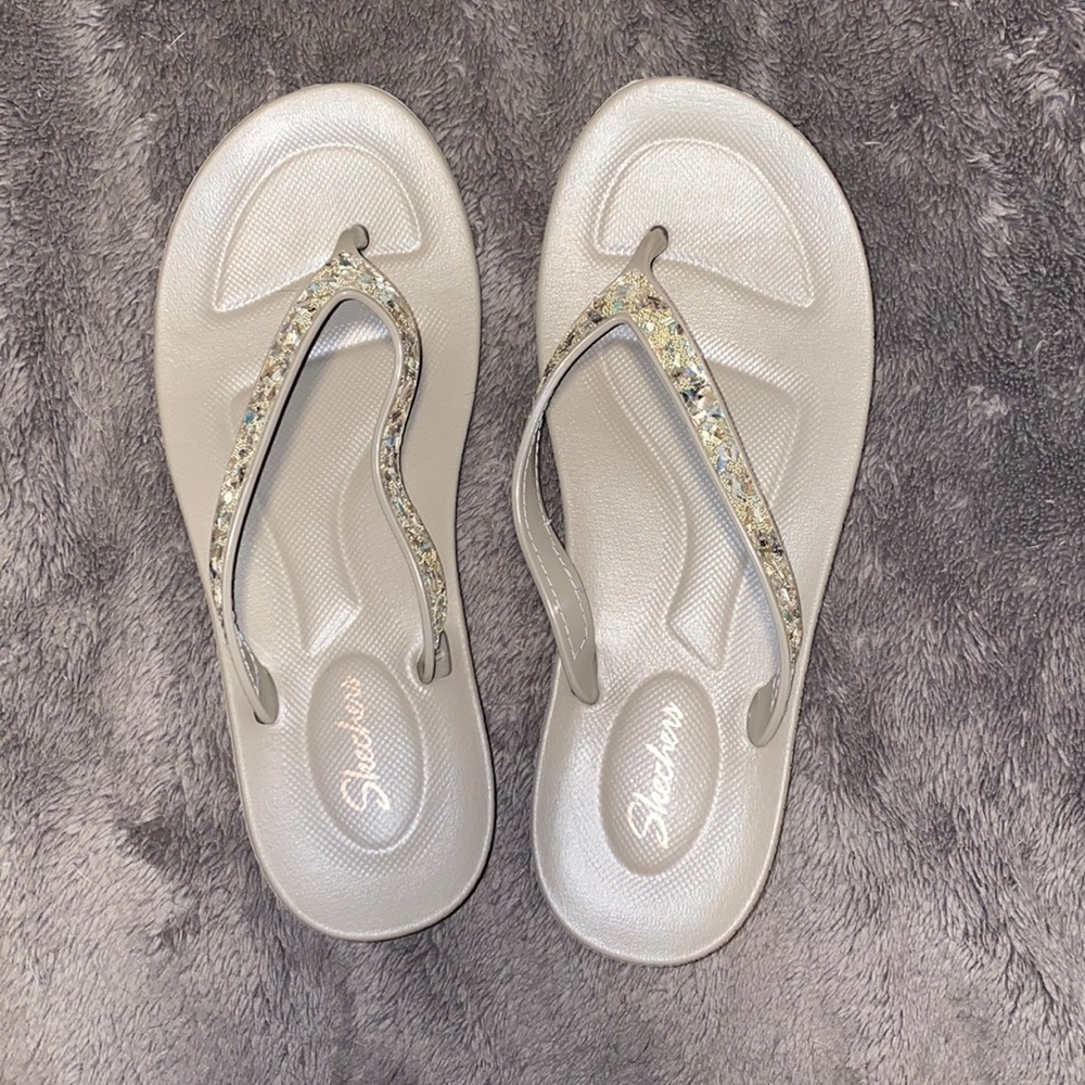 Brand new rubber Sketchers flip flops.